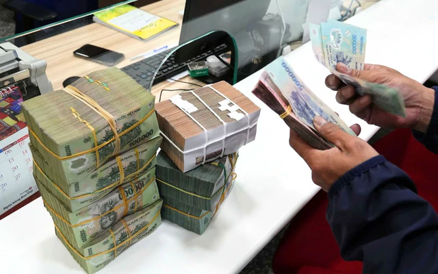 Lãi suất tiền gửi ngân hàng lên trên 9%, Ngân hàng Nhà nước nói tốc độ tăng đang chậm lại - Ảnh 1.